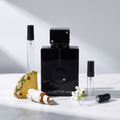 Decant de Armaf Club de Nuit Intense Man en 3, 5 y 10 ml junto a la botella negra original con su medallon de Armaf