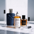 Pack Los Que No Se Ven en el Mall: Parfums de Marly Layton, Replica By The Fireplace y Gisada Ambassador sobre mármol, con los tres atomizadores