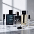 Pack Para la Pega: Bleu de Chanel EDP, Acqua di Giò Parfum y Dior Homme Sport sobre mármol, con los tres atomizadores de 3, 5 y 10 ml