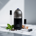 Decant de Pasha de Cartier Édition Noire junto a los tres atomizadores de vidrio de 3, 5 y 10 ml